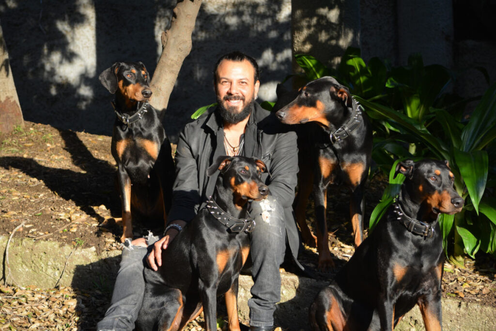 Paolo With His Doberman Pinschers Poi, Emi, Kai & Zoi Web